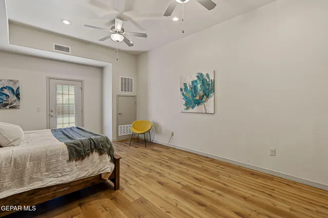 a bedroom with a bed and dresser