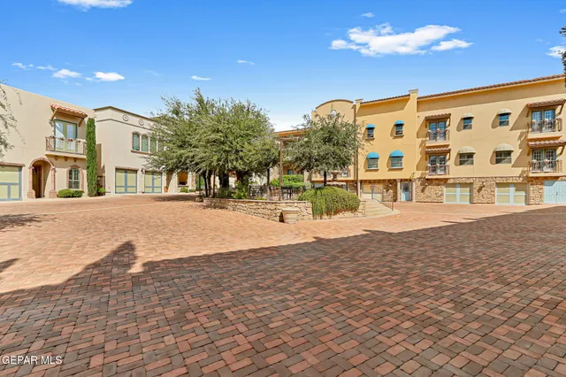 an aerial view of a golf course with parking space