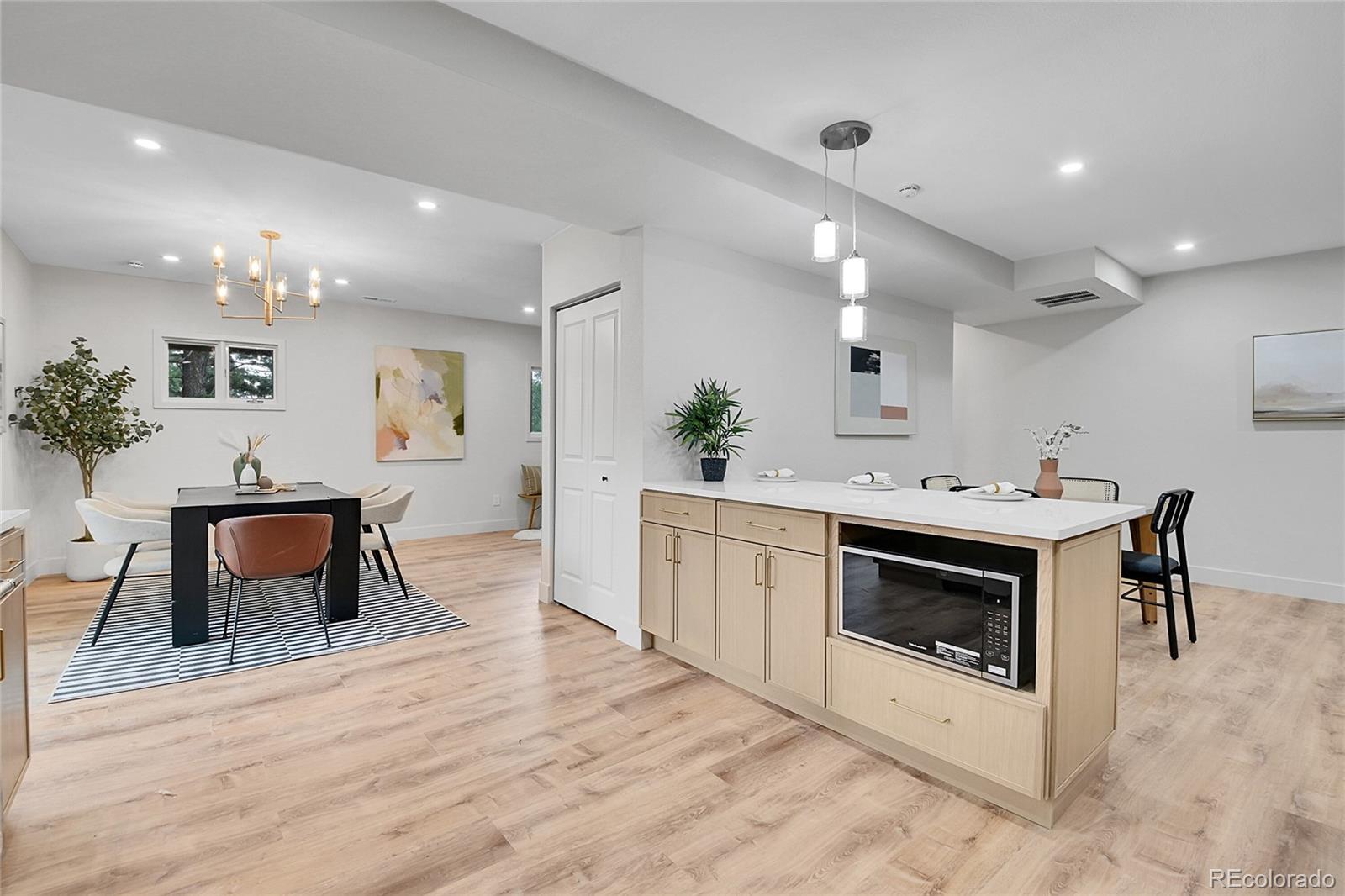 8919 South Hillview Road Morrison, CO 80465 - Photo 11 of 50 a kitchen with furniture and a fireplace