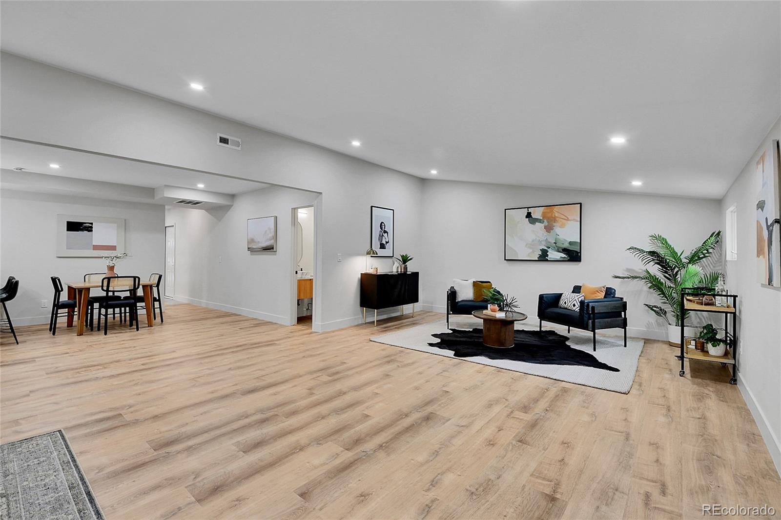 8919 South Hillview Road Morrison, CO 80465 - Photo 17 of 50 a room with furniture and a wooden floor