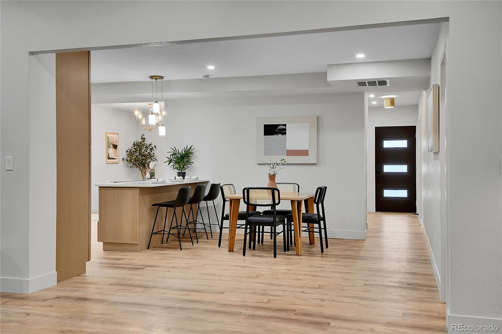8919 South Hillview Road Morrison, CO 80465 - Photo 19 of 50 a view of a dining room with furniture and wooden floor