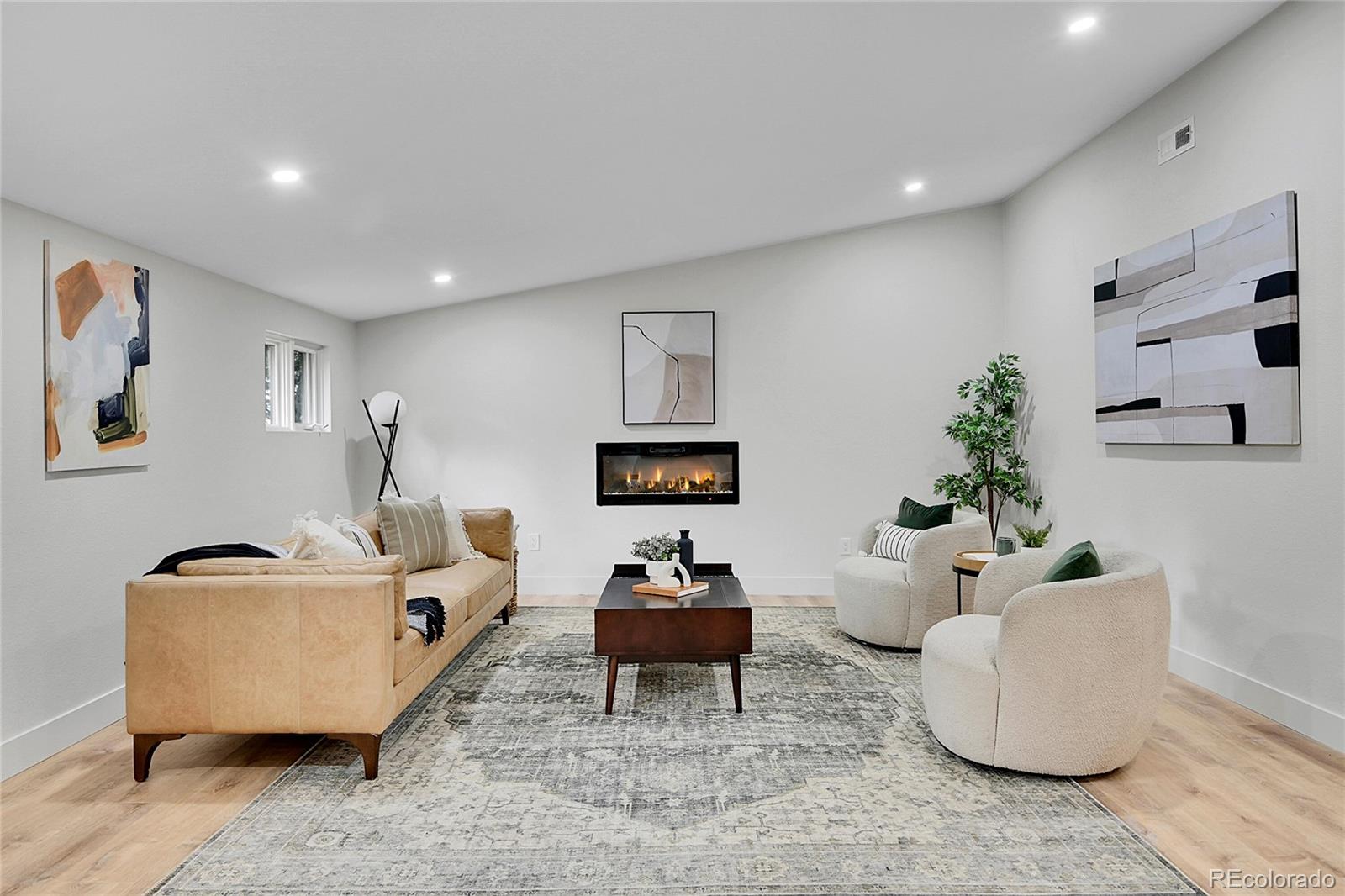 8919 South Hillview Road Morrison, CO 80465 - Photo 20 of 50 a living room with furniture and a potted plant