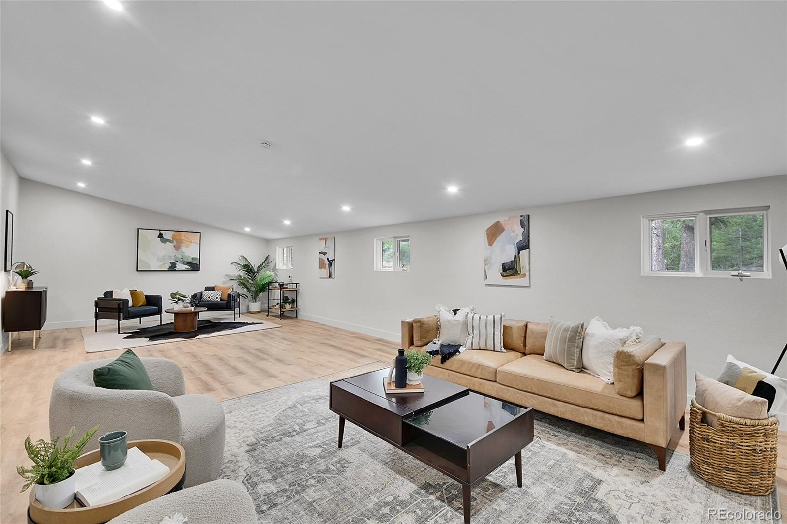 8919 South Hillview Road Morrison, CO 80465 - Photo 22 of 50 a living room with furniture and a wooden floor