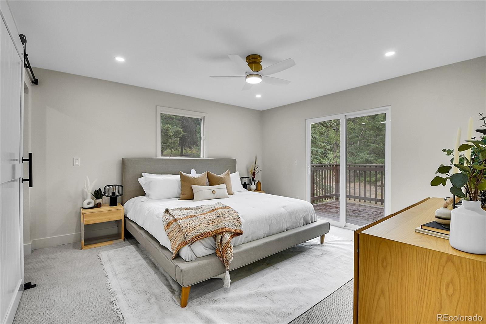 8919 South Hillview Road Morrison, CO 80465 - Photo 25 of 50 a bedroom with a bed and a table in it