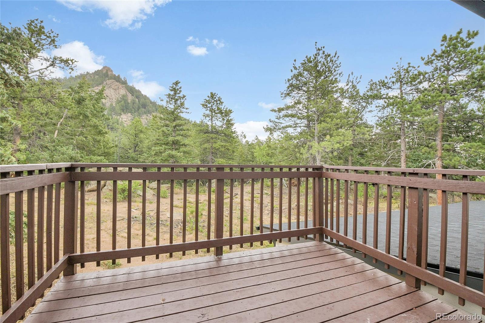 8919 South Hillview Road Morrison, CO 80465 - Photo 26 of 50 a view of wooden balcony with outdoor space