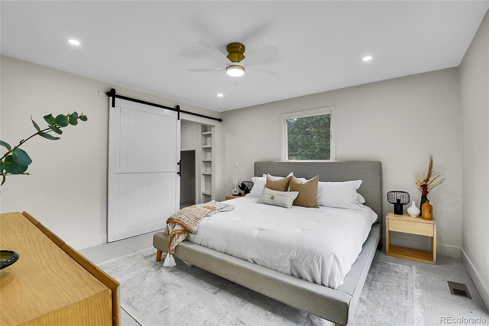 8919 South Hillview Road Morrison, CO 80465 - Photo 27 of 50 a bedroom with a bed and a refrigerator