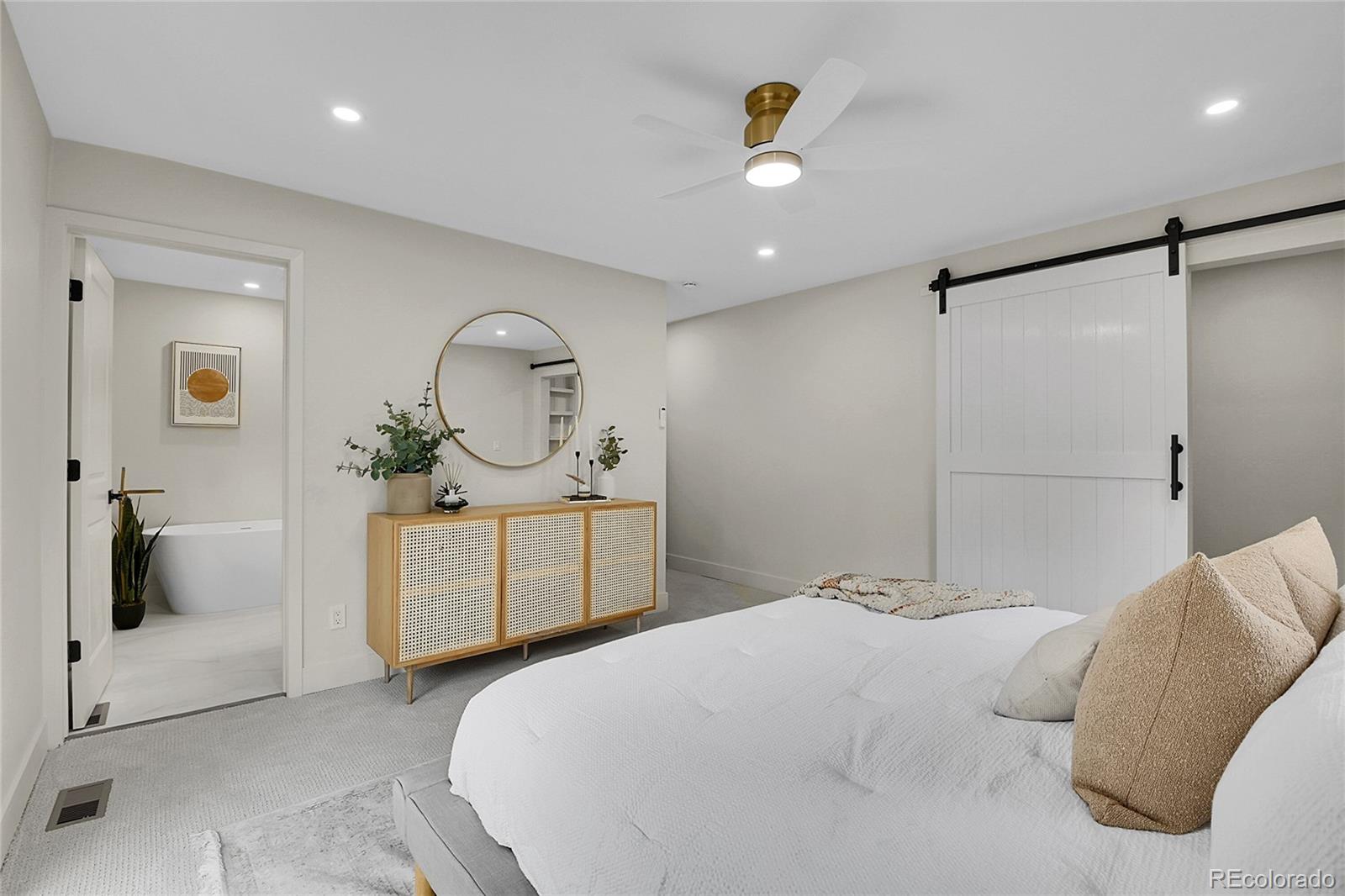 8919 South Hillview Road Morrison, CO 80465 - Photo 28 of 50 a bedroom with a bed and a chandelier