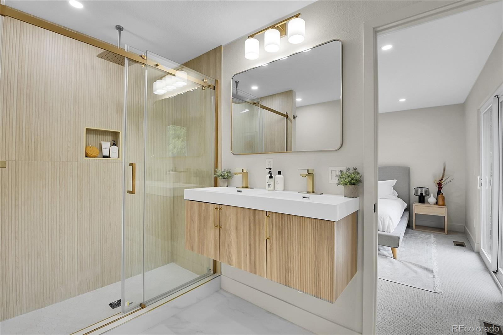 8919 South Hillview Road Morrison, CO 80465 - Photo 30 of 50 a bathroom with a sink mirror and a shower