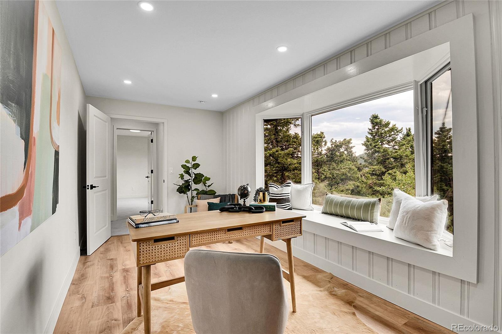 8919 South Hillview Road Morrison, CO 80465 - Photo 34 of 50 a dining room with furniture and large windows