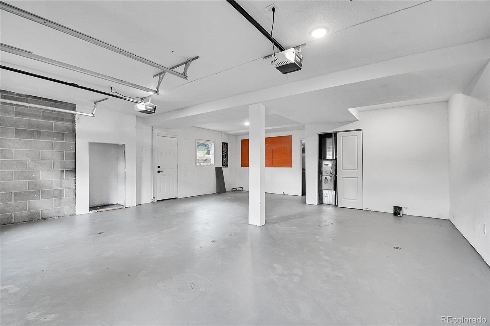 8919 South Hillview Road Morrison, CO 80465 - Photo 41 of 50 an empty room with a empty space and windows