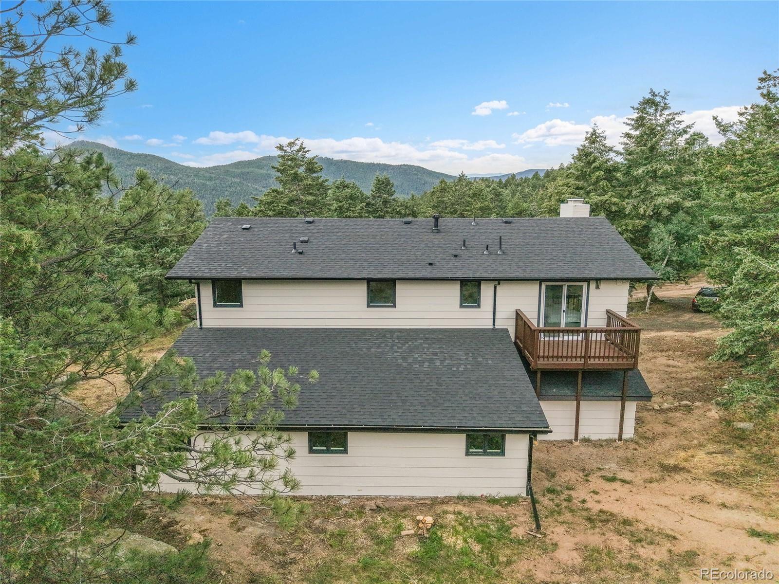 8919 South Hillview Road Morrison, CO 80465 - Photo 44 of 50 aerial view of a house with a yard