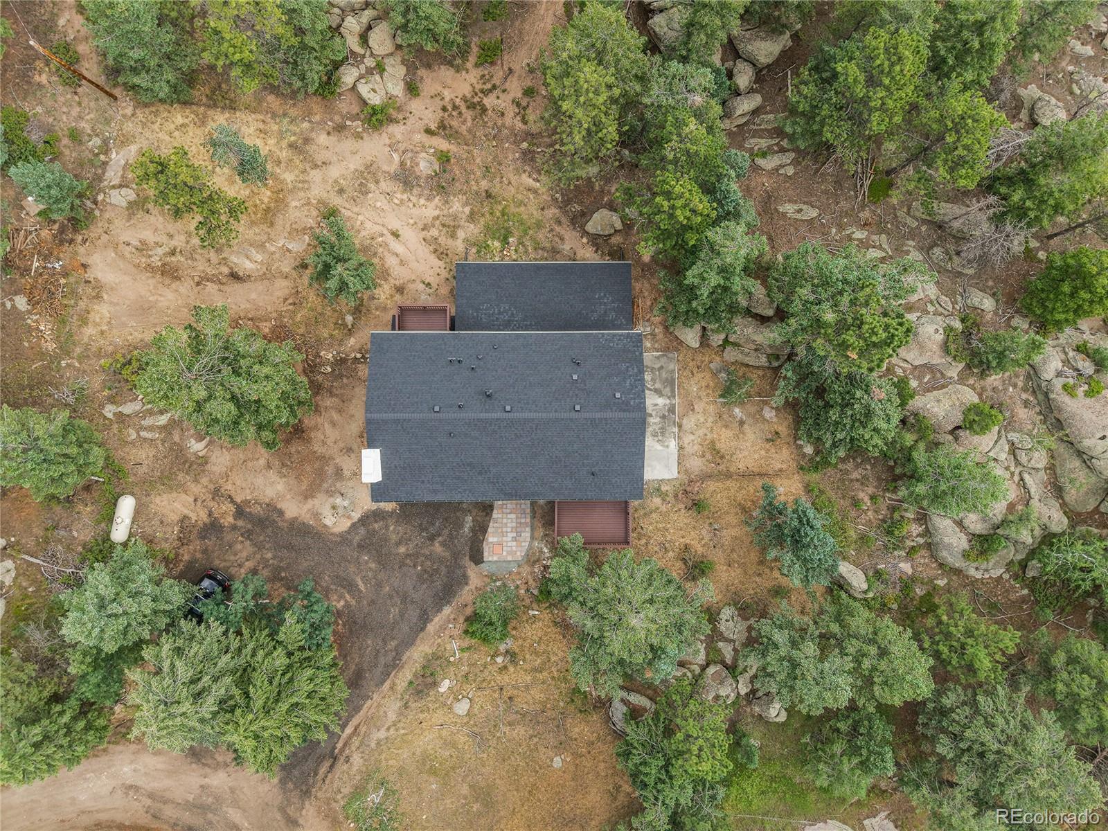 8919 South Hillview Road Morrison, CO 80465 - Photo 45 of 50 an aerial view of a house with a yard