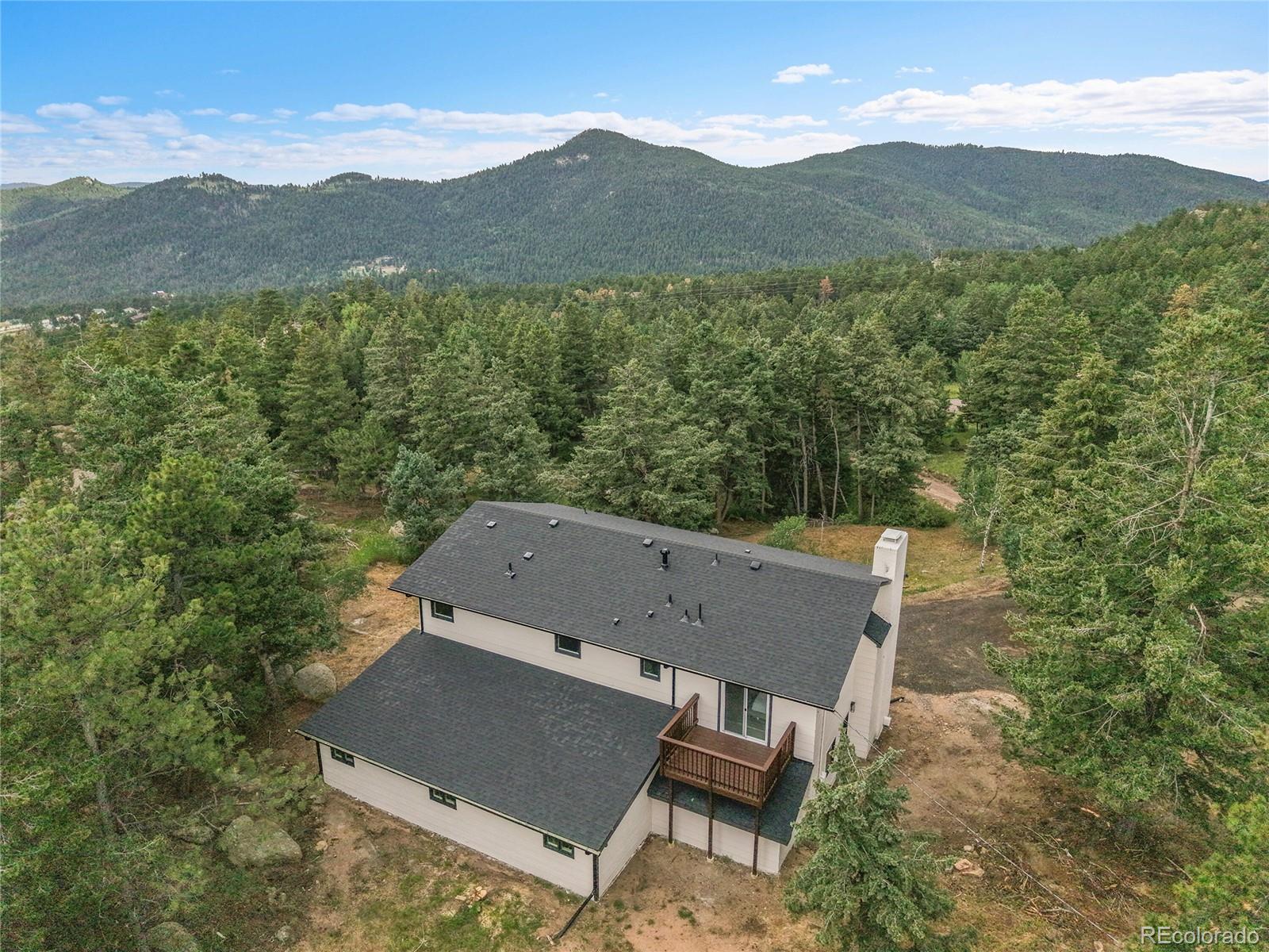 8919 South Hillview Road Morrison, CO 80465 - Photo 46 of 50 an aerial view of a house with mountain view