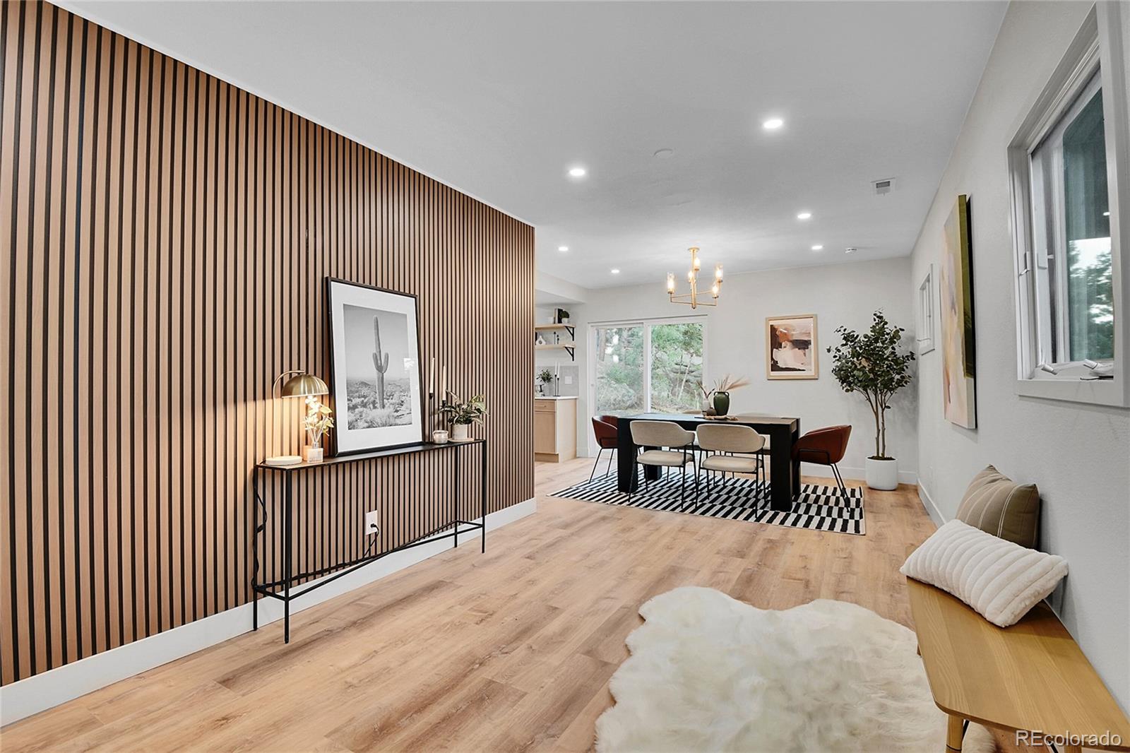 8919 South Hillview Road Morrison, CO 80465 - Photo 5 of 50 a bedroom with furniture and a window