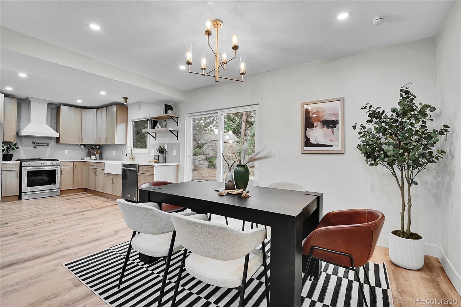 8919 South Hillview Road Morrison, CO 80465 - Photo 7 of 50 a view of a dining room with furniture and wooden floor