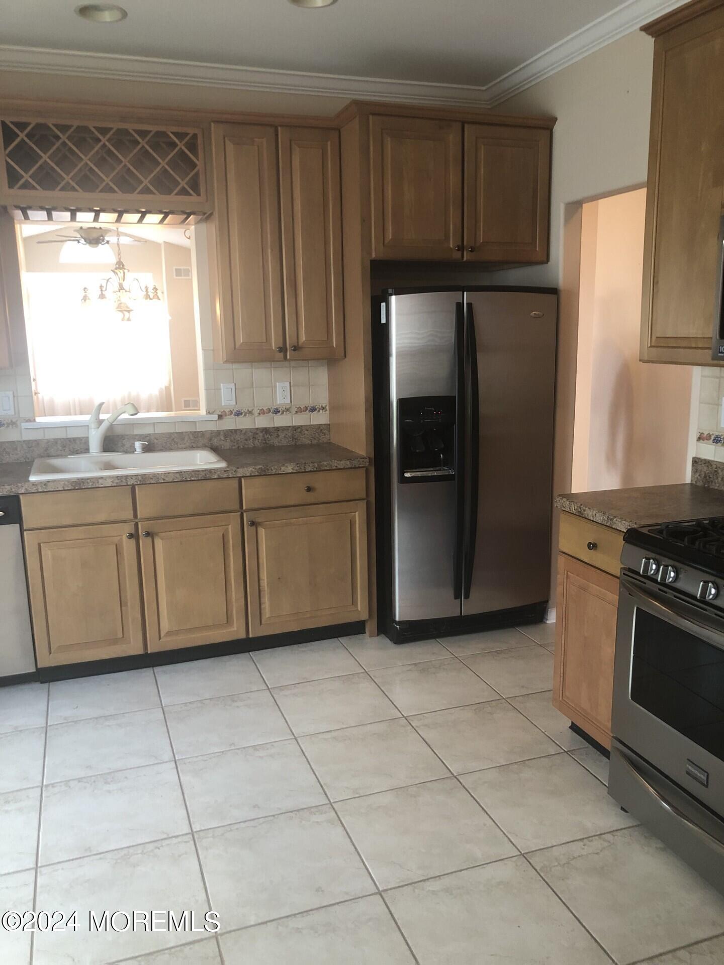 9 Modena Court Manchester Township, NJ 08759 - Photo 2 of 10 a kitchen with stainless steel appliances granite countertop a refrigerator sink and stove