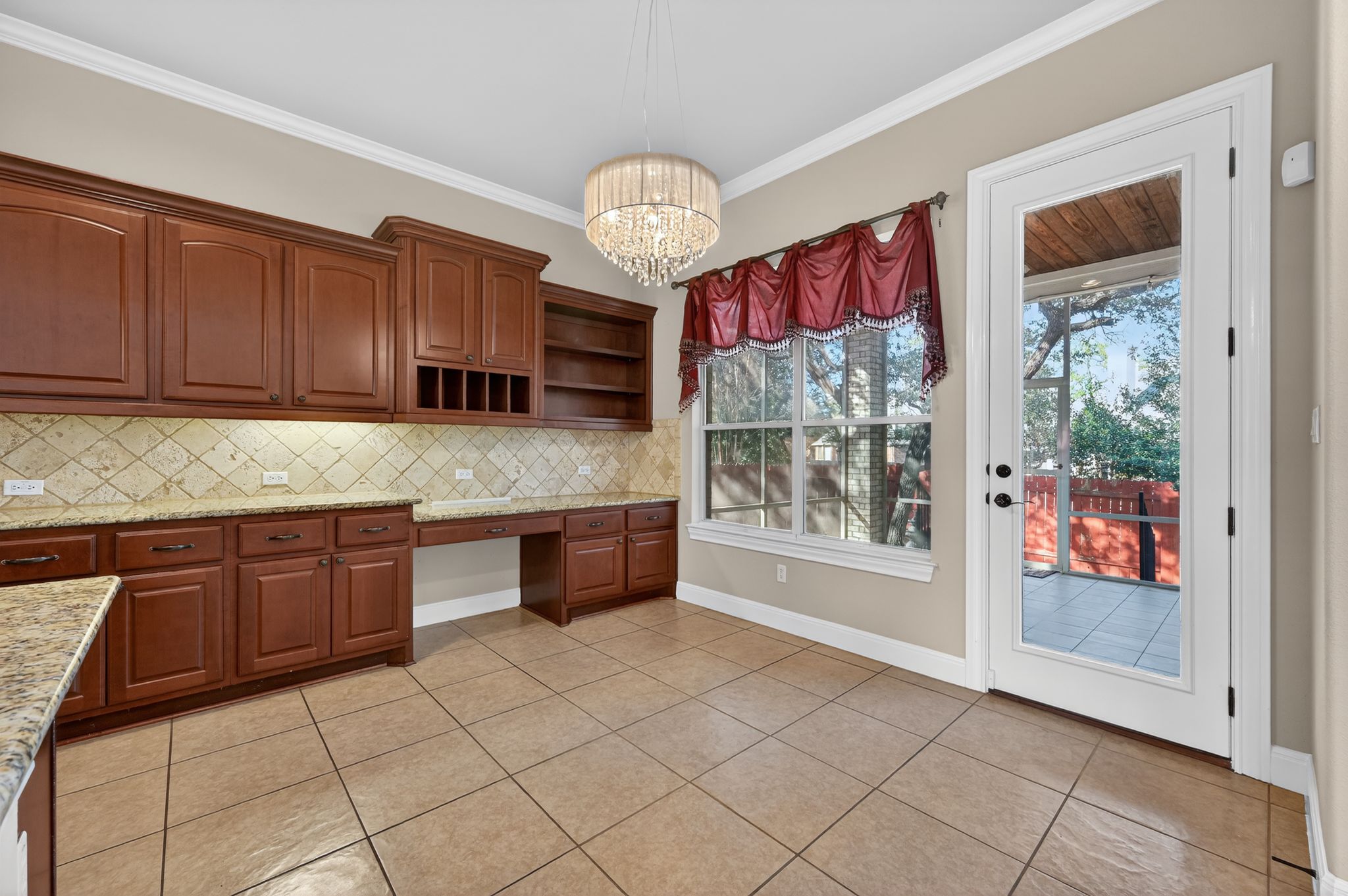 3903 Remington Road Cedar Park, TX 78613 - Photo 13 of 40 a kitchen with granite countertop a stove a sink and a cabinets