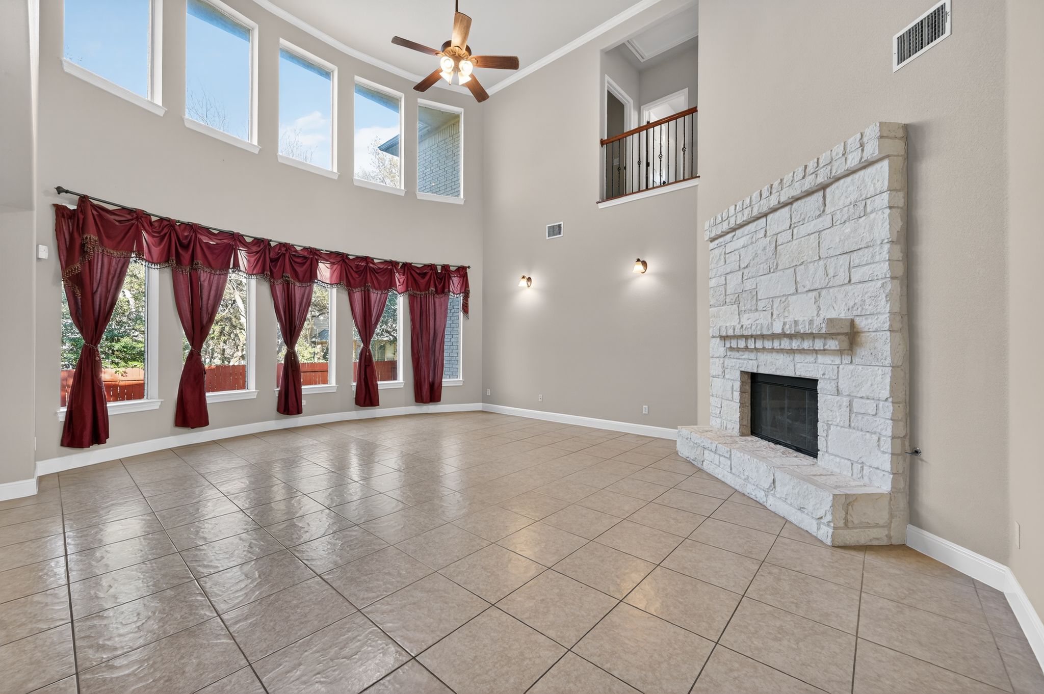 3903 Remington Road Cedar Park, TX 78613 - Photo 16 of 40 an empty room with windows and fireplace