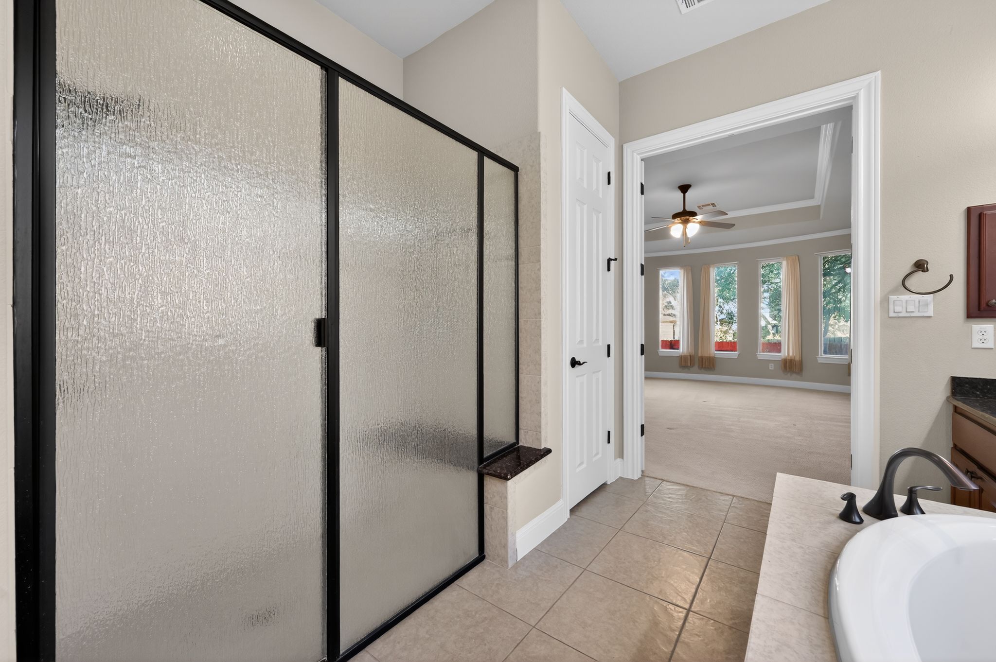 3903 Remington Road Cedar Park, TX 78613 - Photo 20 of 40 a bathroom with a shower and mirror