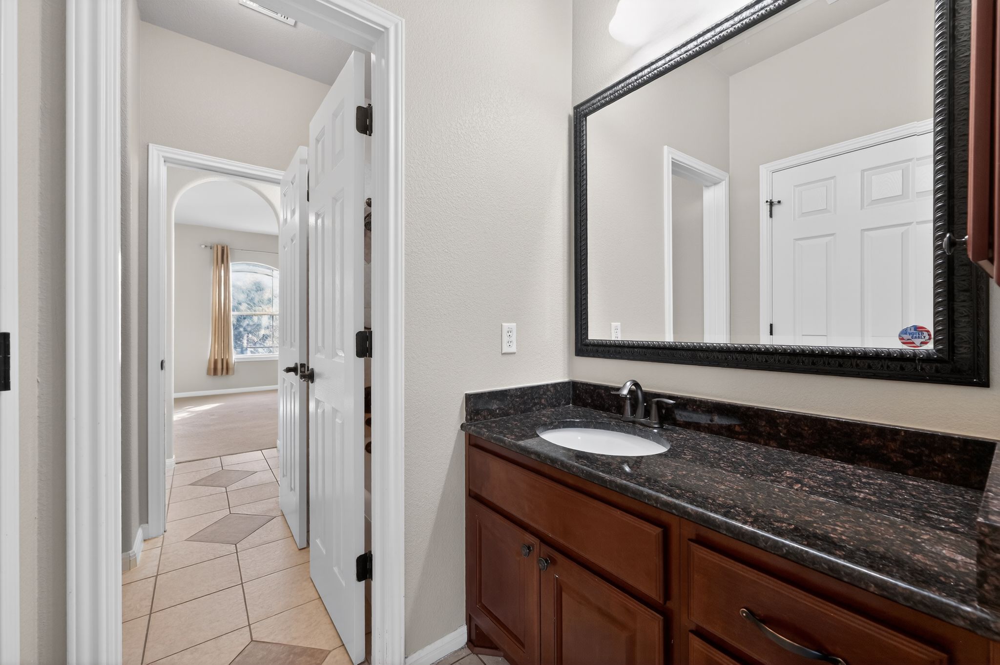 3903 Remington Road Cedar Park, TX 78613 - Photo 31 of 40 a bathroom with a granite countertop sink and a mirror