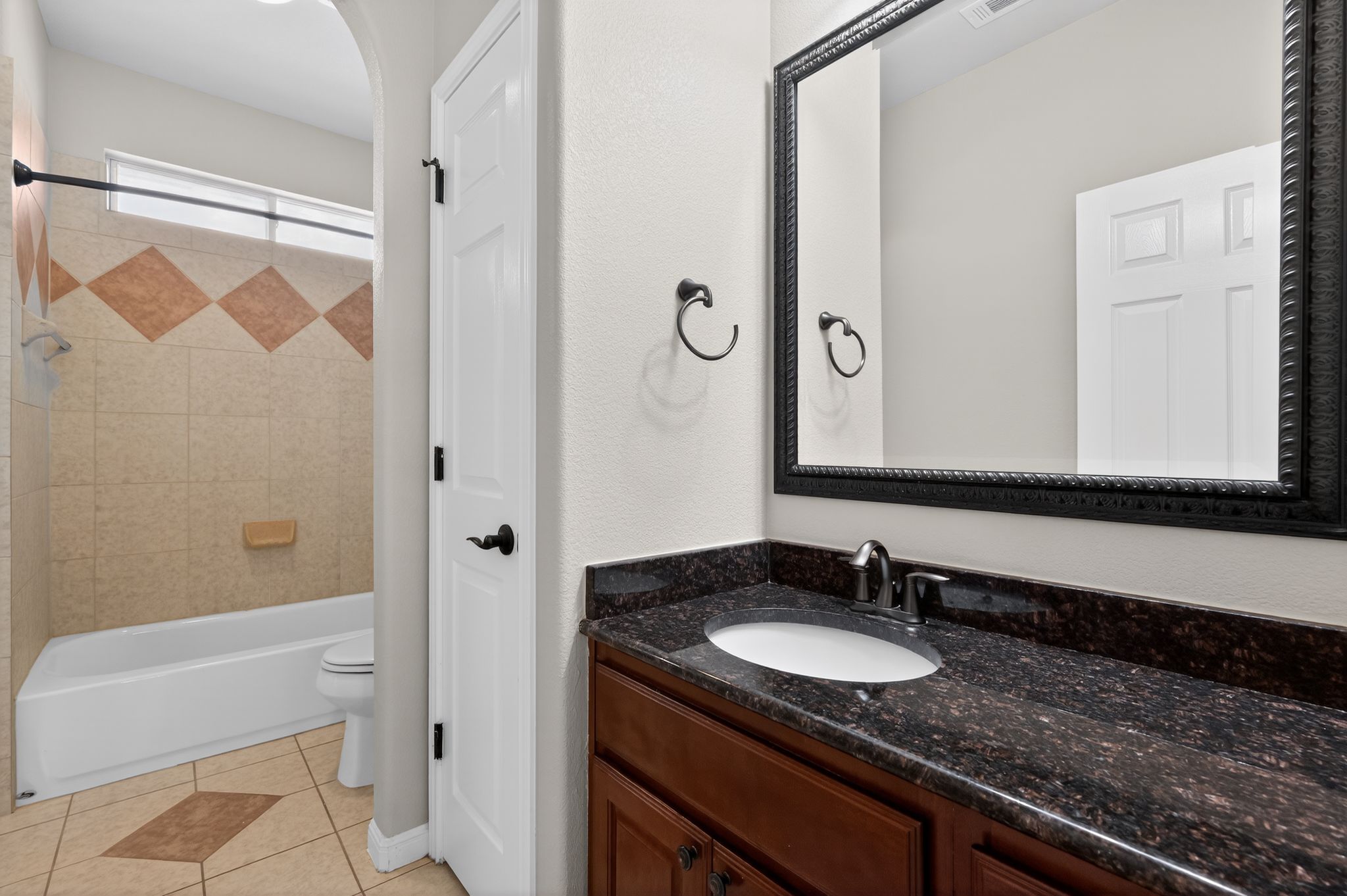 3903 Remington Road Cedar Park, TX 78613 - Photo 33 of 40 a bathroom with a granite countertop sink and a mirror