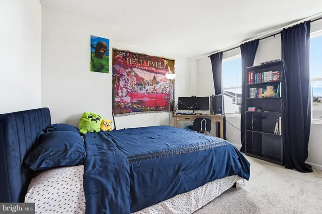 a bed room with a bed and a television