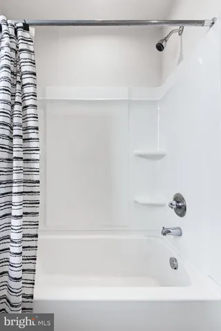 a bathroom with a shower and a shower