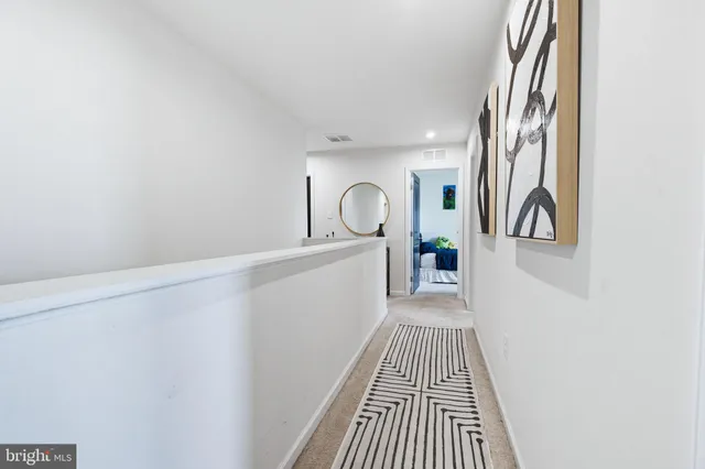 a view of a hallway with windows