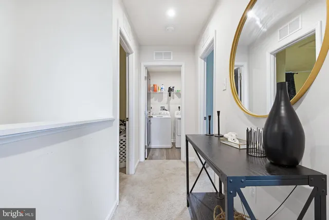 a view of a mirror and bathroom