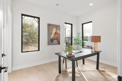 a workspace with furniture and window