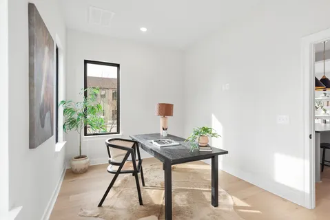 a workspace with furniture and a window