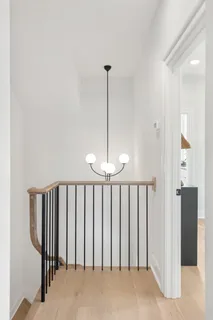 a view of hallway with chandelier