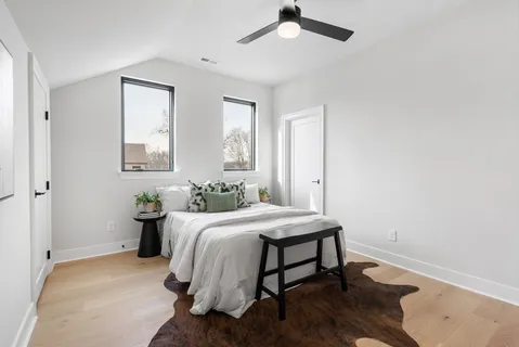 a bedroom with a bed and a table in it