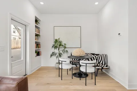 a view of a livingroom with furniture and wooden floor