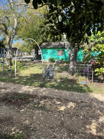 a view of yard with swimming pool