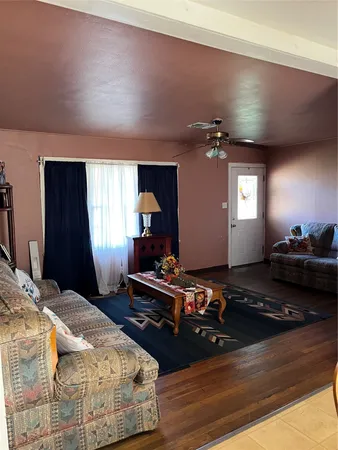 a bedroom with bed window and dresser