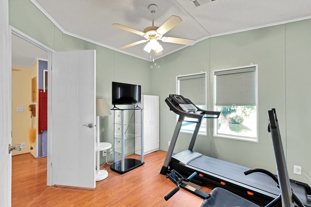 7605 Cedar Bark Road Sebastian, FL 32976 - Photo 18 of 34 a room with furniture and wooden floor