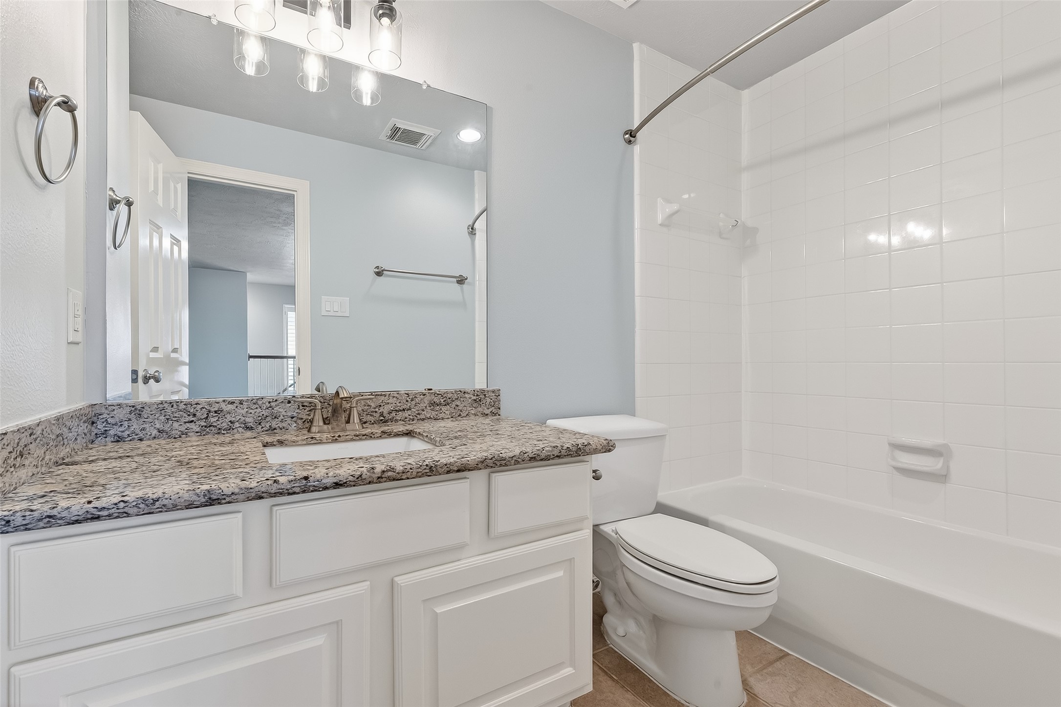 5835 Val Verde Street Houston, TX 77057 - Photo 20 of 21 a bathroom with a granite countertop sink toilet and shower
