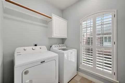 a view of storage and utility room with washer and dryer
