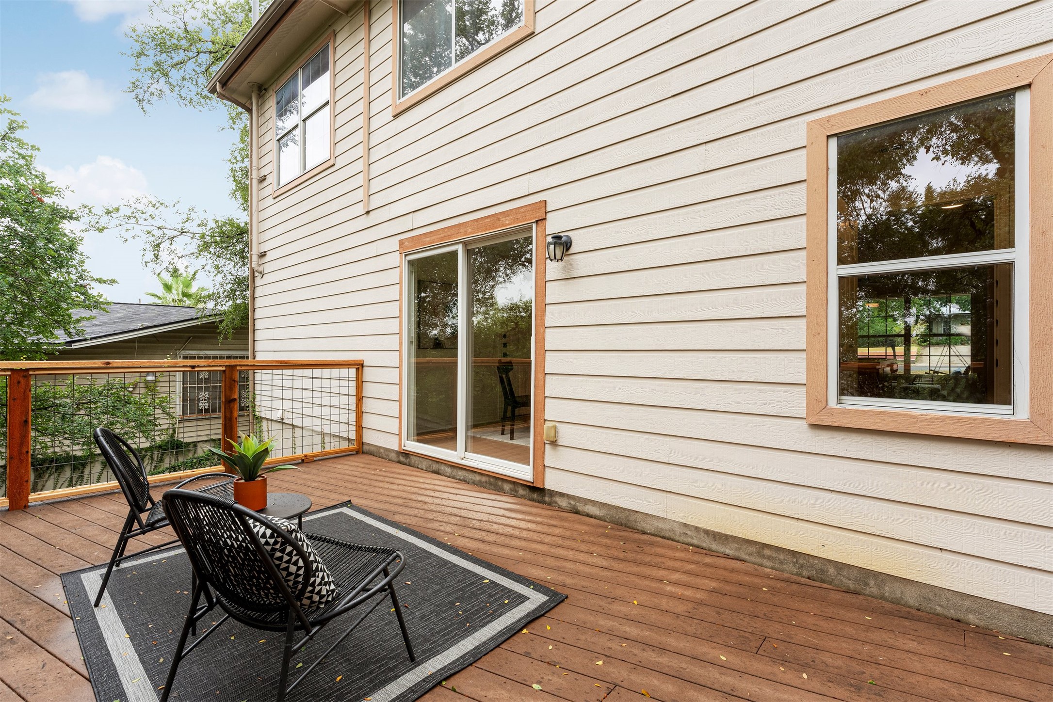 3003 Glen Rae Street Austin, TX 78702 - Photo 30 of 38 Accessed directly via sliding doors from the dining room, this deck functions as a peaceful outdoor living room
