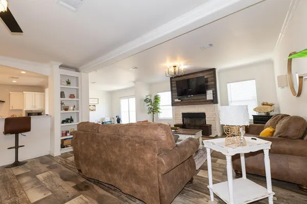a kitchen with kitchen island a sink stainless steel appliances and cabinets