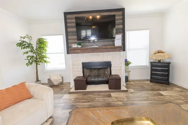 a kitchen with stainless steel appliances a stove a sink and a microwave