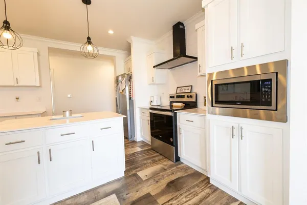 a view of a kitchen with a sink and a window