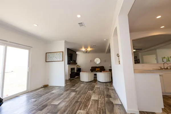 a spacious bathroom with a double vanity sink mirror and bathtub