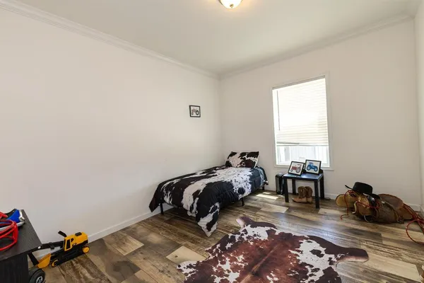 a bedroom with furniture and a window