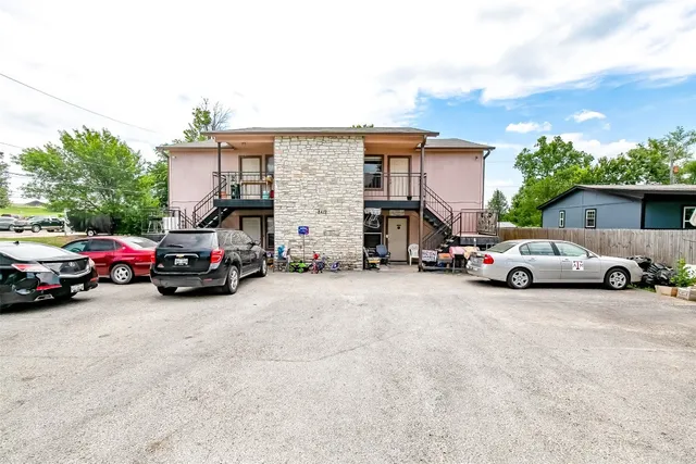 a view of a cars parked in front of a house