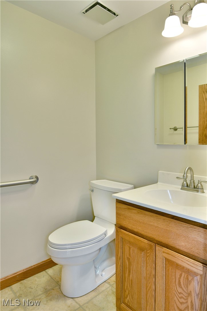 2153 Stillwagon Road Southeast Warren, OH 44484 - Photo 22 of 50 Bathroom featuring toilet and vanity