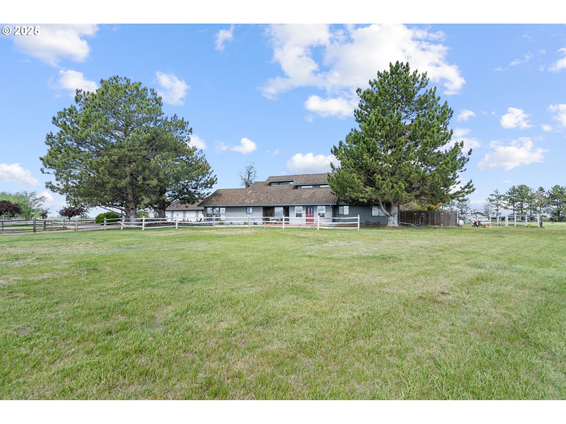 33551 East Progress Road Hermiston, OR 97838 - Photo 1 of 35 a view of green field with tree in the background
