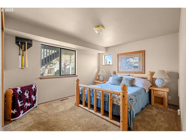 a bedroom with furniture and window