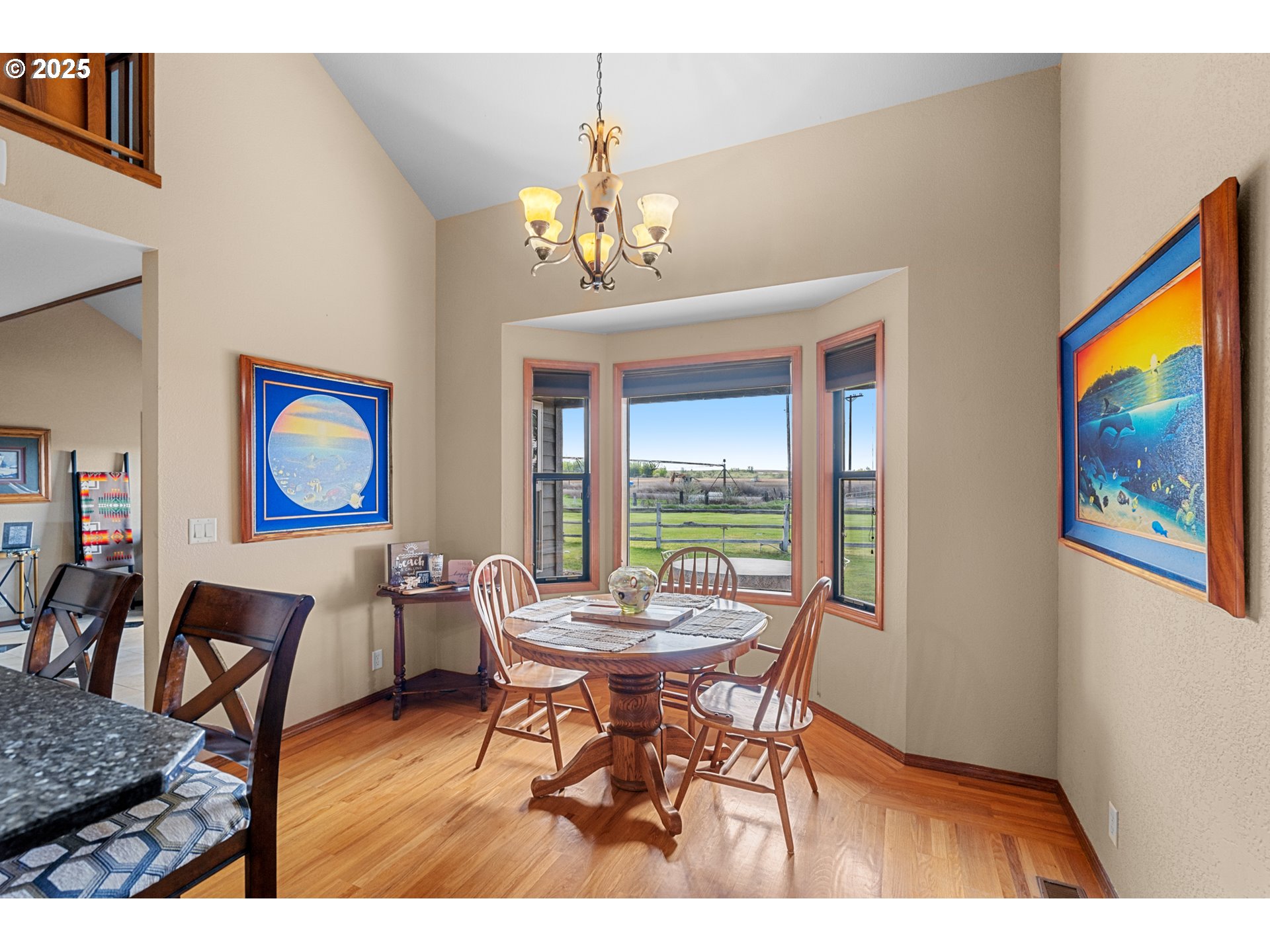 33551 East Progress Road Hermiston, OR 97838 - Photo 18 of 35 a view of a dining room with furniture wooden floor and a chandelier